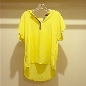 Yellow woman’s top.